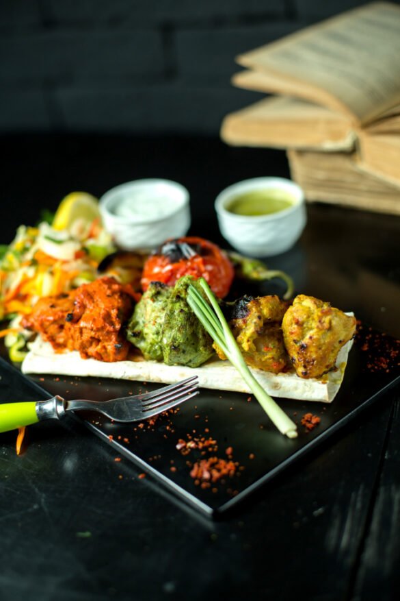 Fresh Punjabi tiffin meal with dal makhani, roti, rice, sabzi, salad, and raita served in traditional containers for daily home-style food delivery